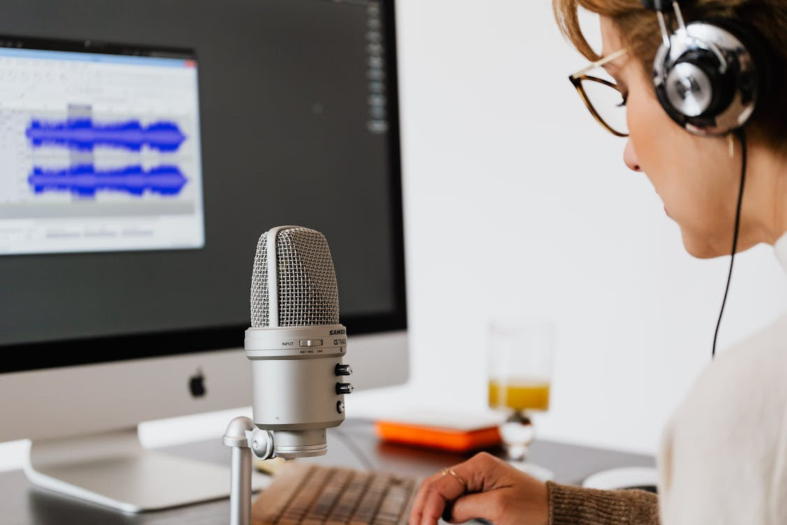 A person using audio software and hardware devices