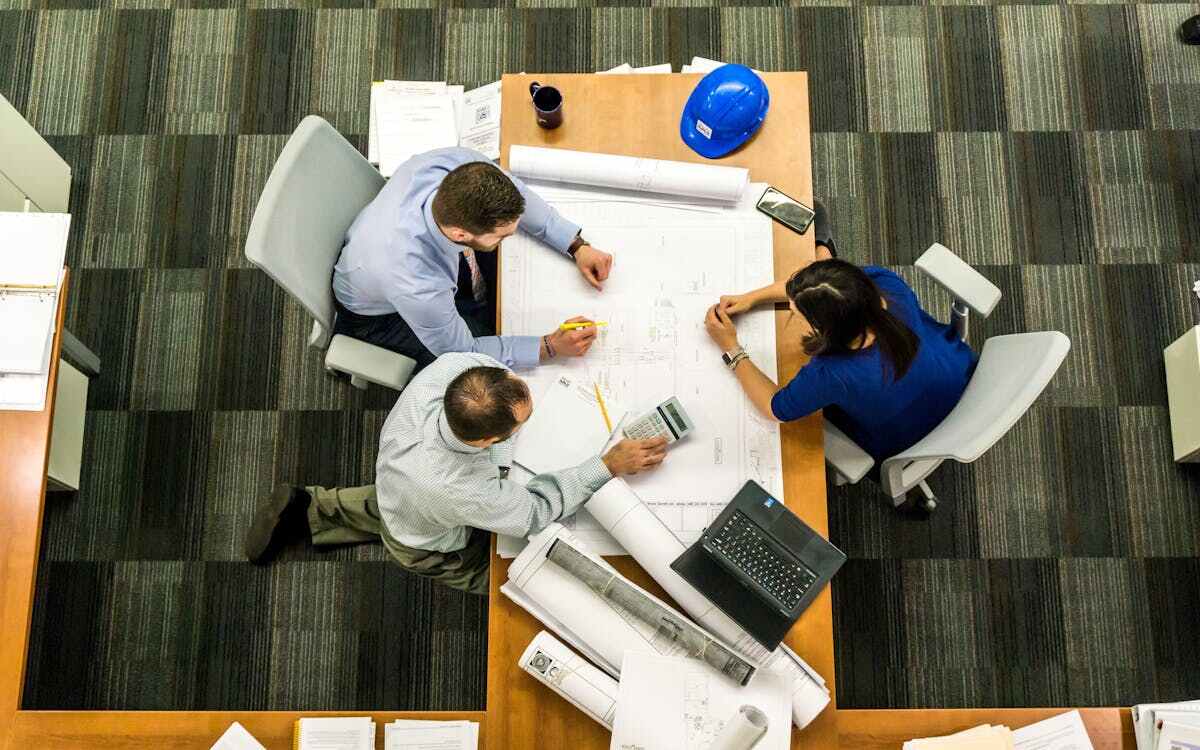 Three architects sitting together at a table